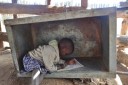 girl drawing in a box