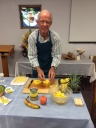 Dick Staats cutting pineapple