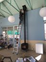 David Omick installing a wood burning stove, photo by Kai Staats