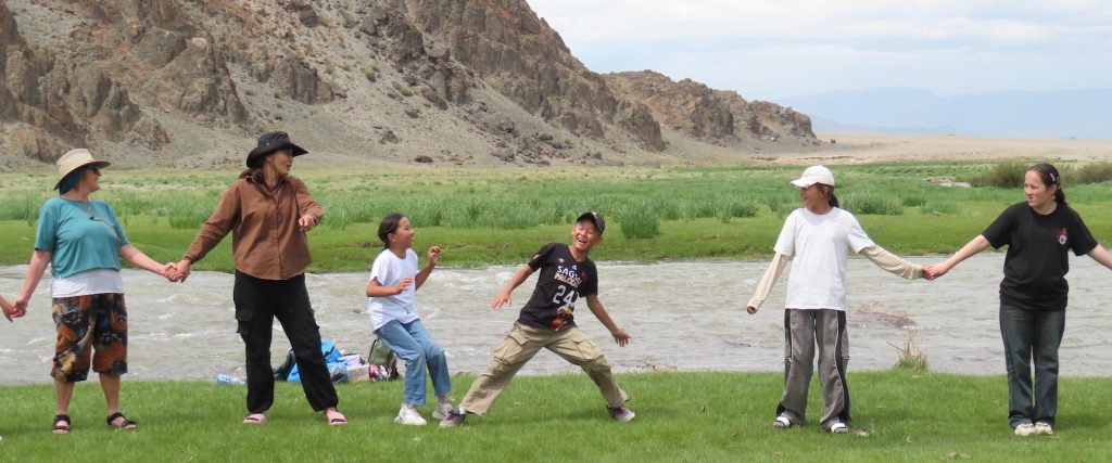 Kids of Sagsai, Mongolia and the Kusvegi English Camp playing near the Tergon river.